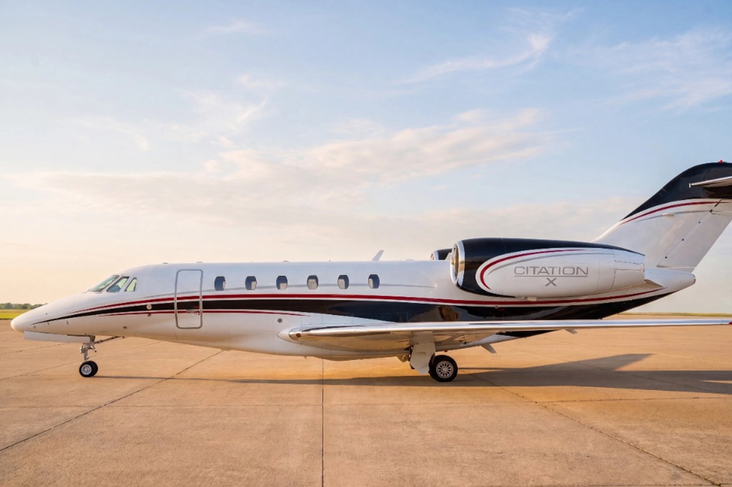 Citation X side profile on the ramp at golden hour with warm sky, representing baseline aircraft presentation