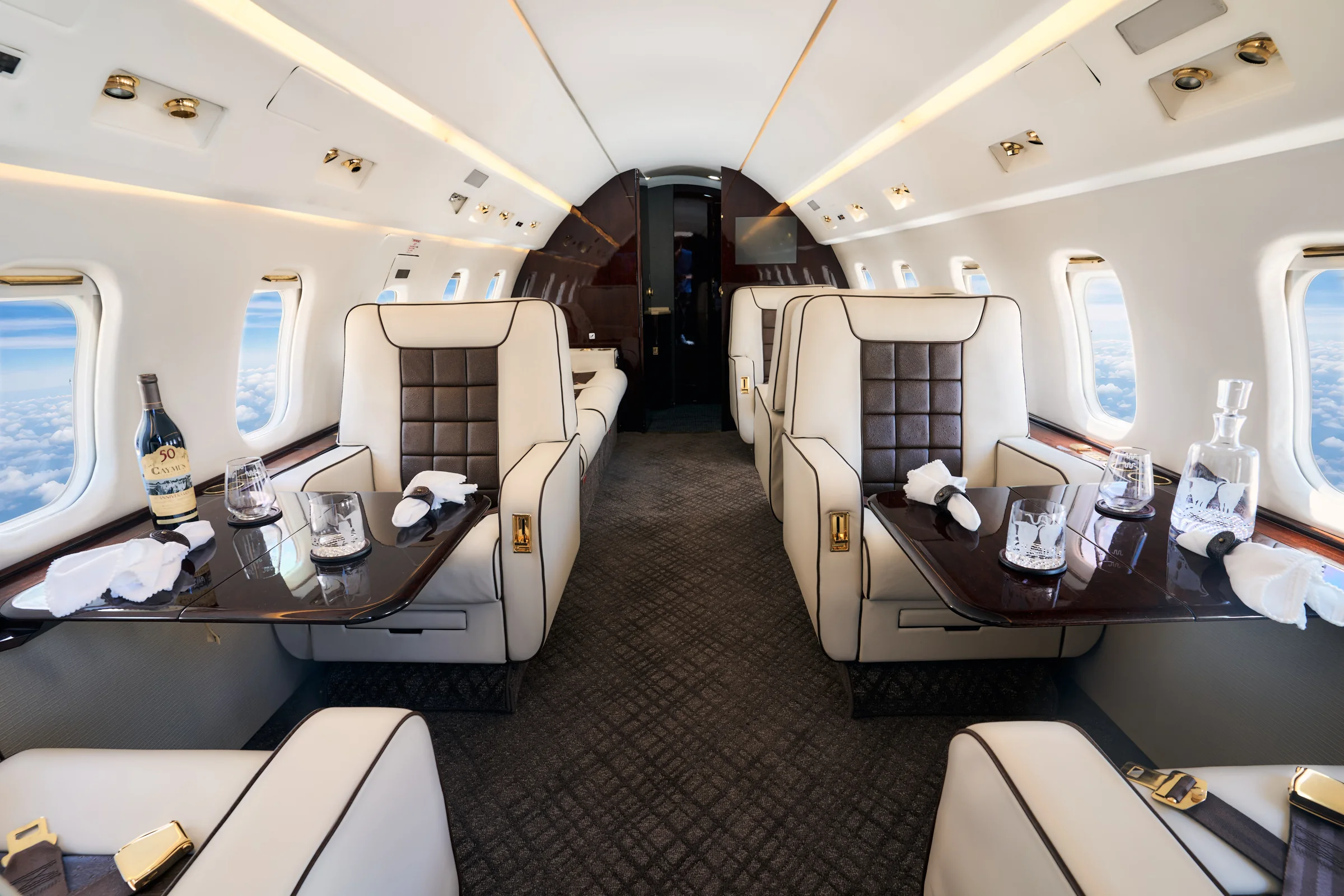 Challenger 350 cabin with paired club tables